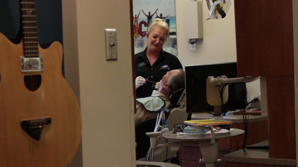 Cigno Family Dental team member discussion treatment options after his emergency dentist visit in Greenfield, WI.